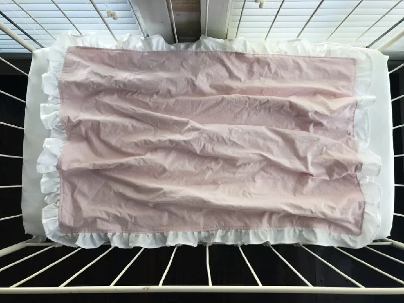 Plush Pillows for a Cozy BedBaby Pink and White Ruffled Crib Blanket